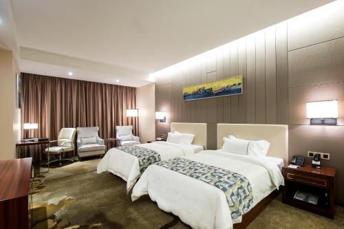 Imagen de la habitación del Hotel Foshan New Junyue International. Foto 7