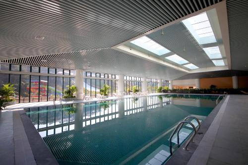 Imagen de la habitación del Hotel Four Points By Sheraton Heyuan Resort. Foto 7