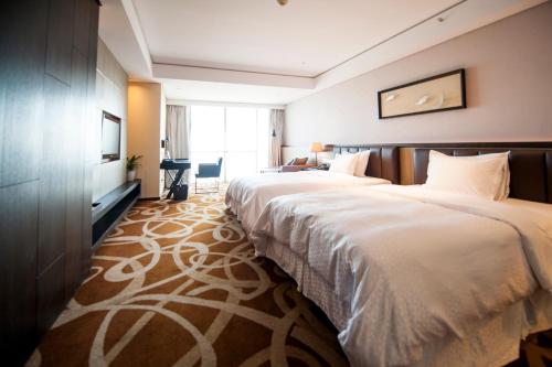 Imagen de la habitación del Hotel Four Points By Sheraton Qingdao, West Coast. Foto 5