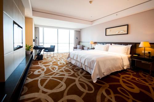 Imagen de la habitación del Hotel Four Points By Sheraton Qingdao, West Coast. Foto 6