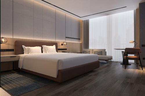 Imagen de la habitación del Hotel Four Points by Sheraton Huzhou. Foto 16