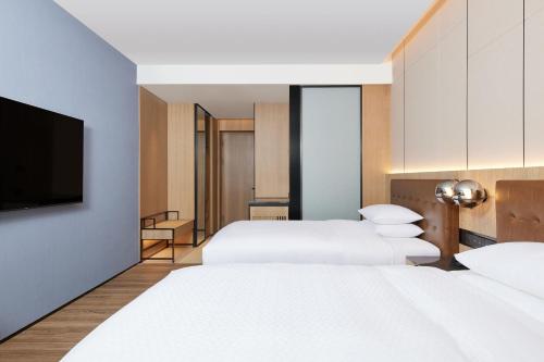 Imagen de la habitación del Hotel Four Points by Sheraton Huzhou. Foto 17