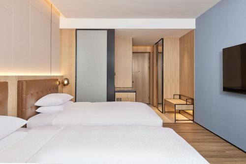 Imagen de la habitación del Hotel Four Points by Sheraton Huzhou. Foto 20