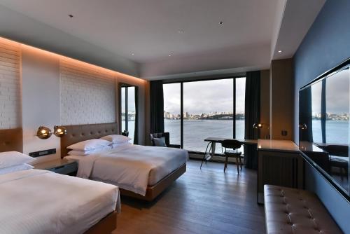 Imagen de la habitación del Hotel Four Points by Sheraton Taipei Bali. Foto 3