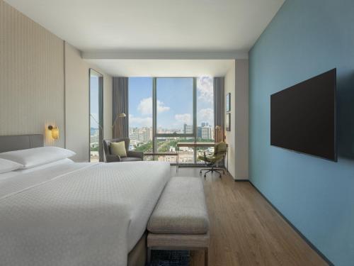 Imagen de la habitación del Hotel Four Points by Sheraton Yantai. Foto 13