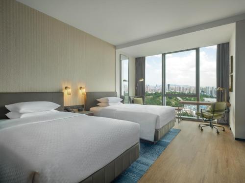 Imagen de la habitación del Hotel Four Points by Sheraton Yantai. Foto 14