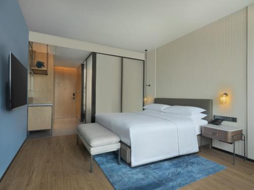 Imagen de la habitación del Hotel Four Points by Sheraton Yantai. Foto 15
