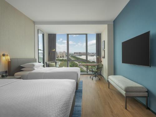 Imagen de la habitación del Hotel Four Points by Sheraton Yantai. Foto 16