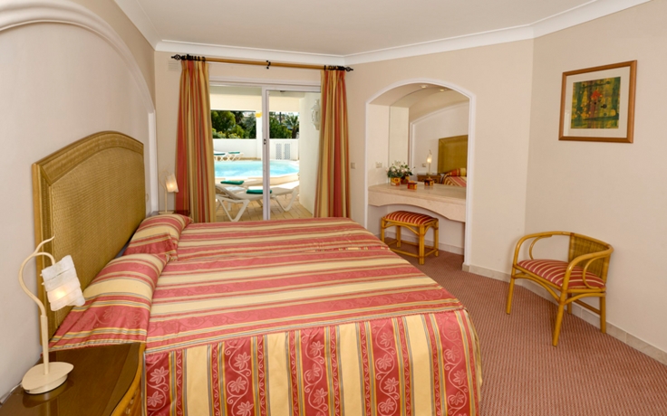 Imagen de la habitación del Hotel Four Seasons Fairways. Foto 9