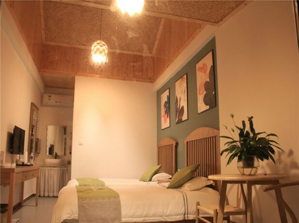 Imagen de la habitación del Hotel Four Seasons Inn Gubei Water Town. Foto 21