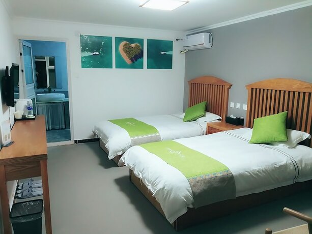 Imagen de la habitación del Hotel Four Seasons Inn Gubei Water Town. Foto 23