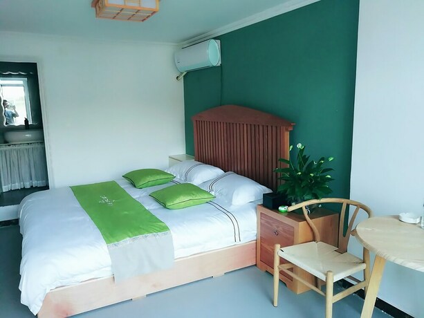 Imagen de la habitación del Hotel Four Seasons Inn Gubei Water Town. Foto 25