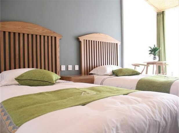 Imagen de la habitación del Hotel Four Seasons Inn Gubei Water Town. Foto 27