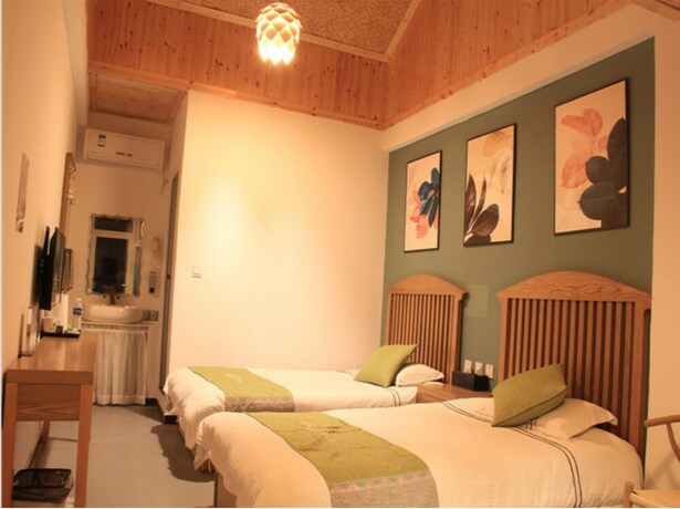 Imagen de la habitación del Hotel Four Seasons Inn Gubei Water Town. Foto 34