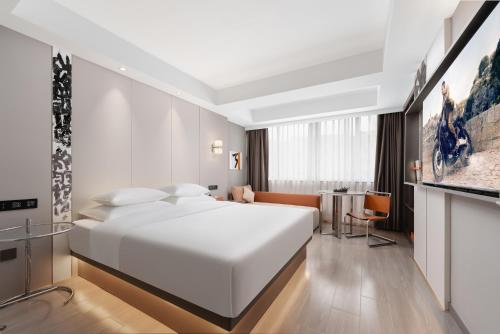 Imagen de la habitación del Hotel Four Seasons, Jinhua. Foto 19