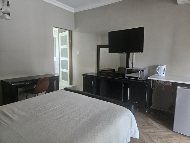 Imagen de la habitación del Hotel Four Seasons Lehae Guest House. Foto 11
