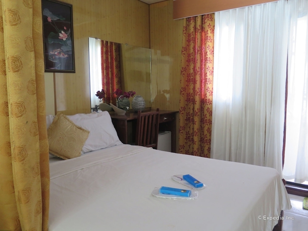 Imagen de la habitación del Hotel Four Seasons Seaview. Foto 8