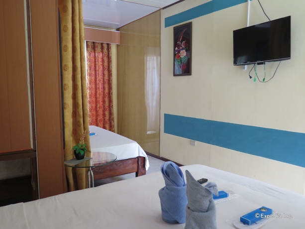 Imagen de la habitación del Hotel Four Seasons Seaview. Foto 9