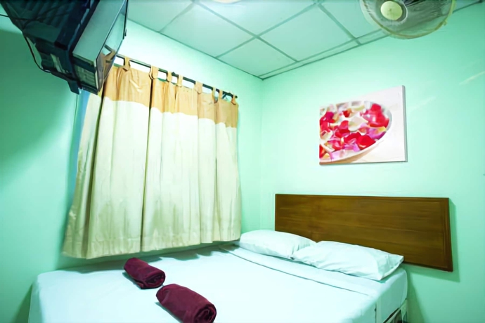 Imagen de la habitación del Hotel Four Sons Village. Foto 12