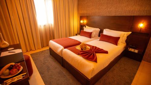 Imagen de la habitación del Hotel Fourteen Ain Sebaa. Foto 15