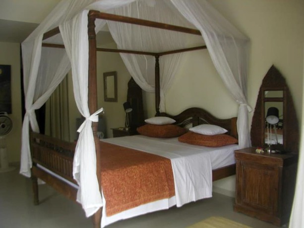 Imagen de la habitación del Hotel Frangipani Beach. Foto 4