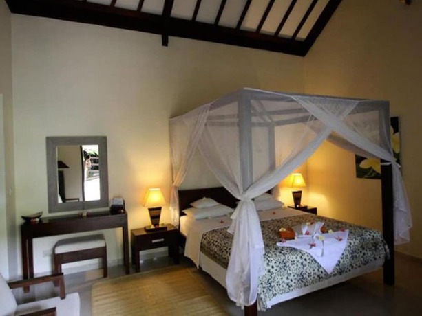 Imagen de la habitación del Hotel Frangipani Beach. Foto 16