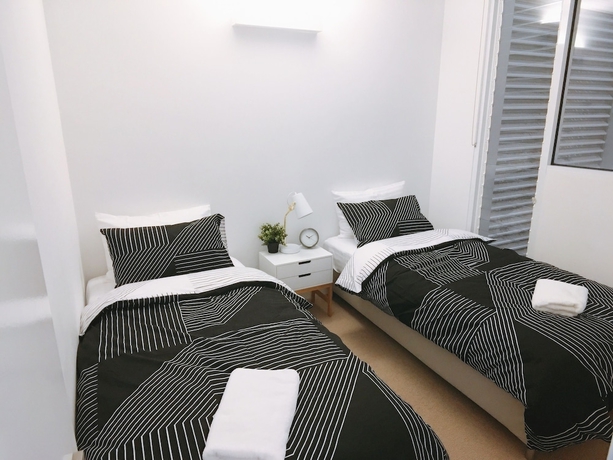 Imagen de la habitación del Hotel Frangipanistays At 589e. Foto 11
