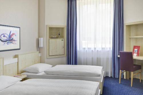 Imagen de la habitación del Hotel Freiburg City Center by Leonardo Hotels. Foto 5