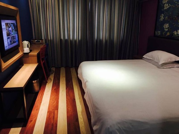 Imagen de la habitación del Hotel Fresh House Huanglong Wantang. Foto 9