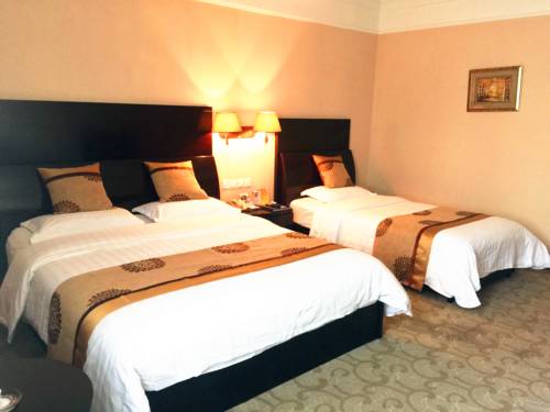 Imagen de la habitación del Hotel Friendship, DALIAN. Foto 4