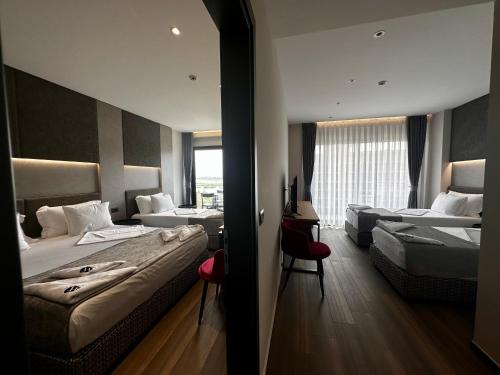 Imagen de la habitación del Hotel Frojd Kune Resort & Beach. Foto 15