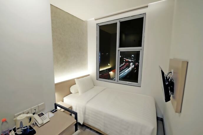 Imagen de la habitación del Hotel Front One Boutique Taman Anggrek. Foto 19