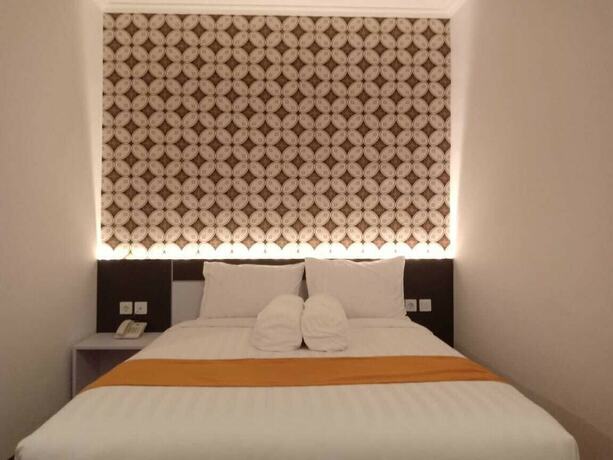 Imagen de la habitación del Hotel Front One Boutique Tugu Muda Semarang. Foto 19