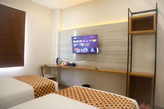 Imagen de la habitación del Hotel Front One Gombong. Foto 13