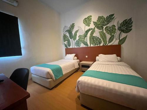 Imagen de la habitación del Hotel Front One Green Boutique Abepura. Foto 15