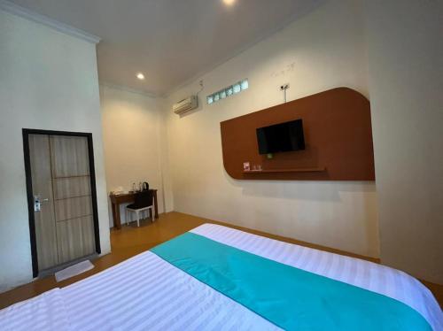Imagen de la habitación del Hotel Front One Green Boutique Abepura. Foto 18