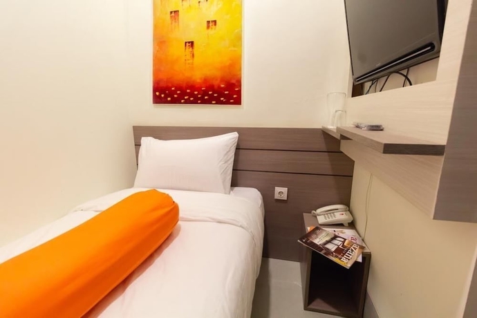 Imagen de la habitación del Hotel Front One Residence Syariah Mampang. Foto 7