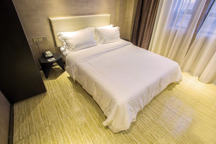Imagen de la habitación del Hotel Fu Qian Ming Tai Serviced Apartment. Foto 5