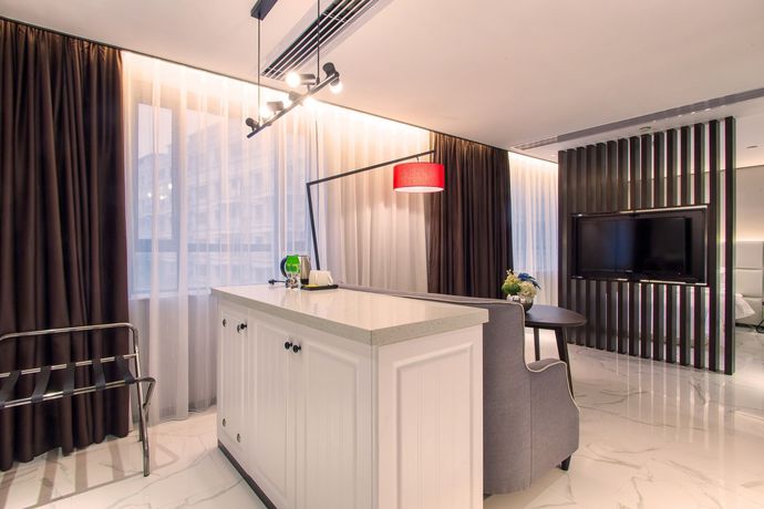 Imagen de la habitación del Hotel Fu Qian Ming Tai Serviced Apartment. Foto 8