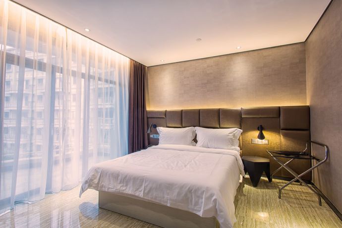 Imagen de la habitación del Hotel Fu Qian Ming Tai Serviced Apartment. Foto 12