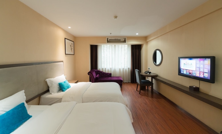 Imagen de la habitación del Hotel Fu Yi Fashion. Foto 11