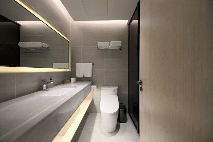 Imagen de la habitación del Hotel Full Season, Qingdao. Foto 7