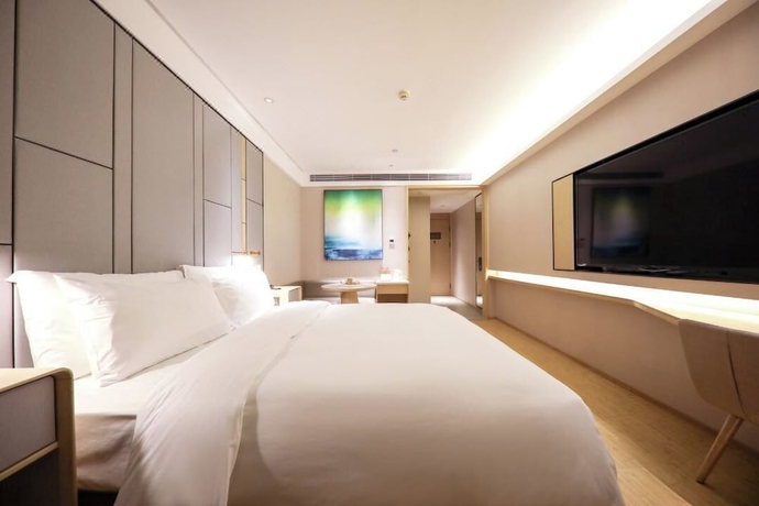 Imagen de la habitación del Hotel Full Season, Qingdao. Foto 8