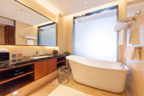 Imagen de la habitación del Hotel Funyard Huizhou. Foto 19