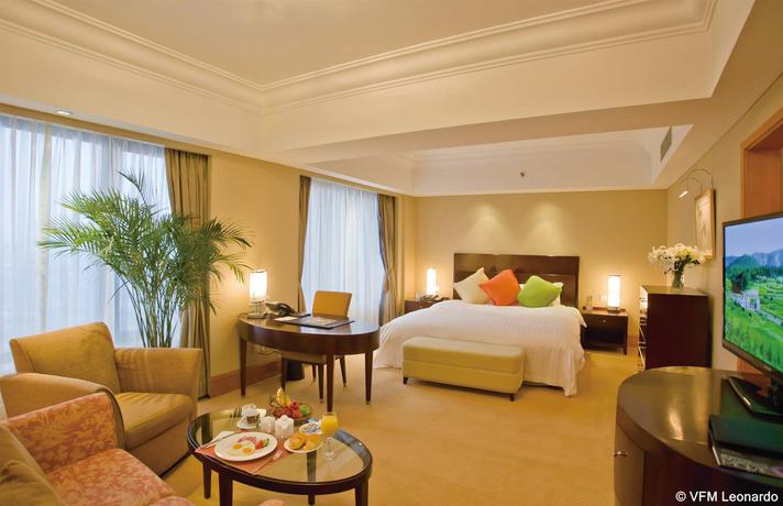 Imagen de la habitación del Hotel Furama Dalian. Foto 7