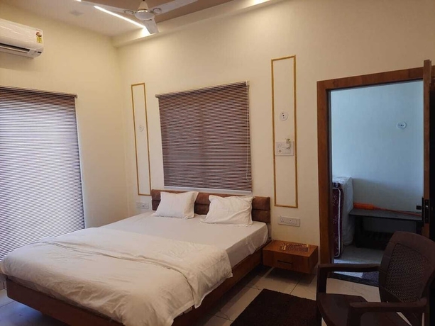 Imagen de la habitación del Hotel G R Inn near Temple and Rail Station. Foto 13