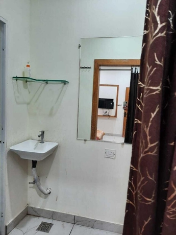 Imagen de la habitación del Hotel G R Inn near Temple and Rail Station. Foto 14