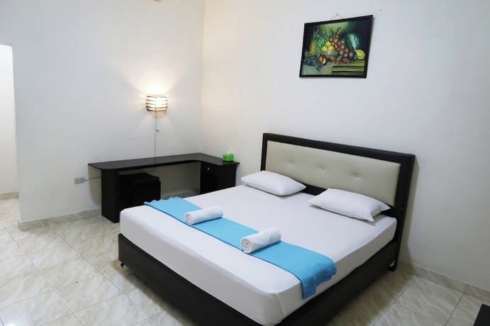 Imagen de la habitación del Hotel G Syariah Bandar Lampung. Foto 2