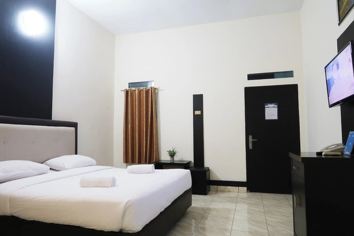 Imagen de la habitación del Hotel G Syariah Bandar Lampung. Foto 8