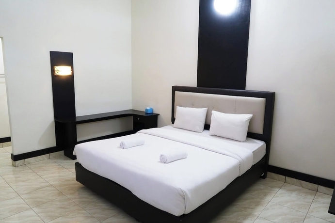 Imagen de la habitación del Hotel G Syariah Bandar Lampung. Foto 9